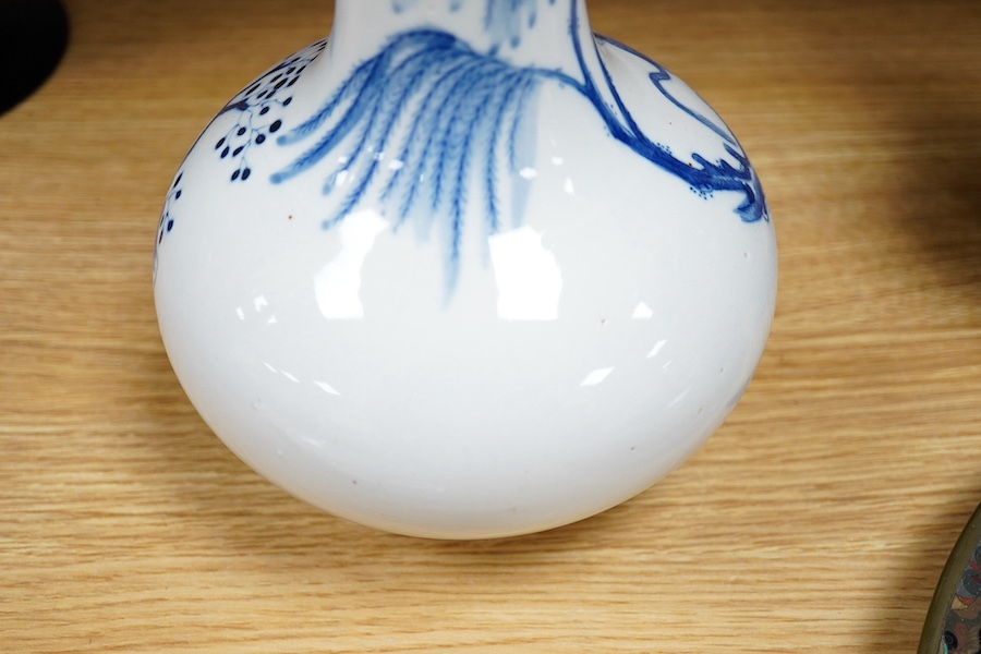 A Chinese blue and white glazed porcelain bottle vase, 27cm high. Condition - good